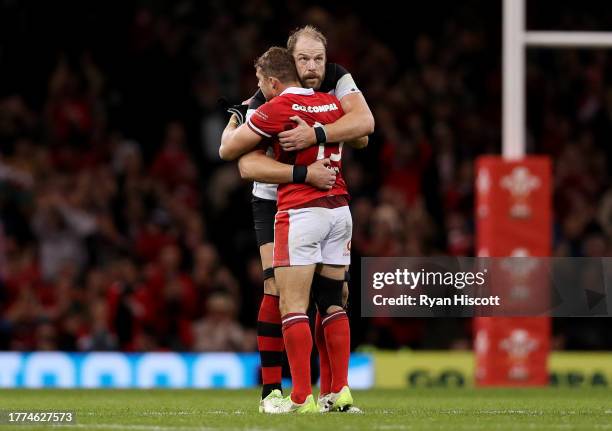 Leigh Halfpenny of Wales is embraced by Alun Wyn Jones of Barbarians, as he leaves the field whilst being substituted during his last appearance for...