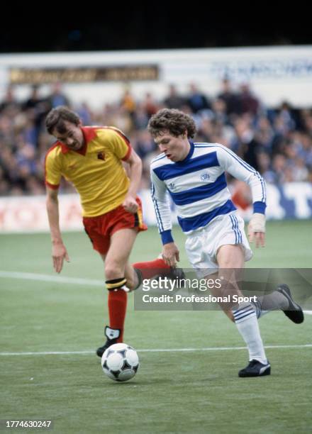 Clive Allen of Queens Park Rangers is closed down by Ian Bolton of Watford during a Football League Division Two match at Loftus Road on April 12,...