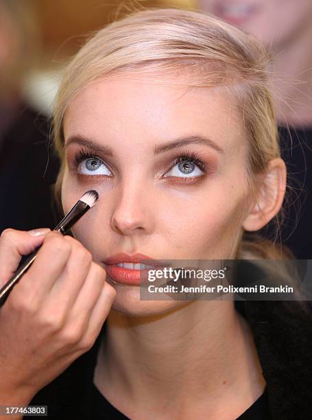 Model prepares backstage ahead of the MBFWA Trends show during Mercedes-Benz Fashion Festival Sydney 2013 at Sydney Town Hall on August 23, 2013 in...
