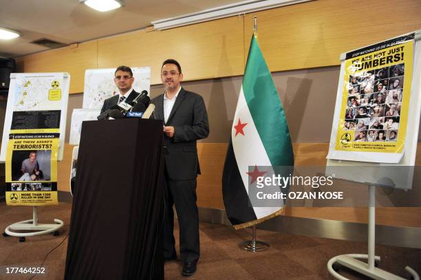 Bader Jamous , the General Secretary of the Syrian National Council and Khaled Saleh , spokesman and director of media for the Syrian National...