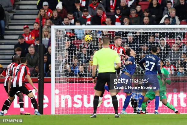 Konstantinos Mavropanos of West Ham United scores an own goal to score Brentford's second goal during the Premier League match between Brentford FC...