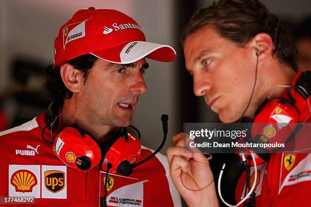 Pedro De La Rosa of Spain and Ferrari talks in the garage following during practice for the Belgian Grand Prix at Circuit de Spa-Francorchamps on...