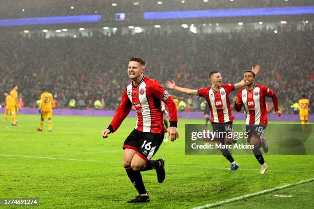 Oliver Norwood of Sheffield United celebrates after scoring the team's second goal from a penalty during the Premier League match between Sheffield...