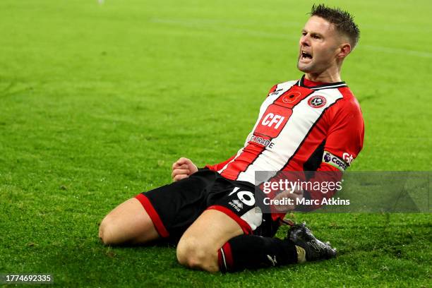 Oliver Norwood of Sheffield United celebrates after scoring the team's second goal from a penalty during the Premier League match between Sheffield...