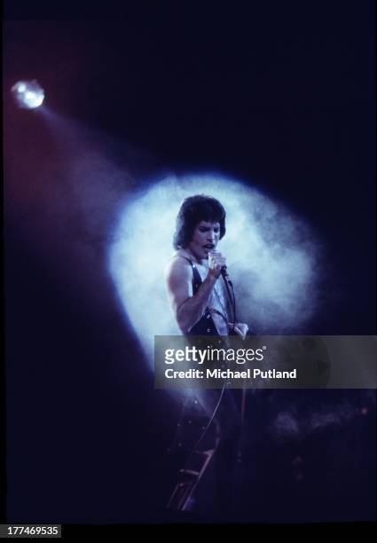 Singer Freddie Mercury of British rock band Queen performing on stage in 1975.
