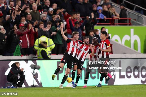 Nathan Collins of Brentford celebrates with Neal Maupay, Yoane Wissa and Christian Norgaard of Brentford after scoring the team's third goal during...