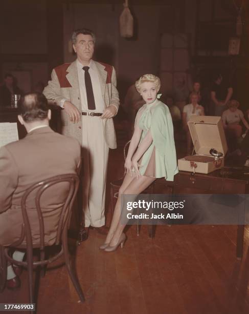 American actress Jane Powell with co-star George Givot on the set of the Warner Brothers film 'Three Sailors and A Girl', 1953.