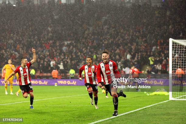 Oliver Norwood of Sheffield United celebrates after scoring the team's second goal from a penalty during the Premier League match between Sheffield...