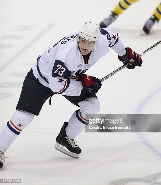 Nic Kerdiles of Team USA skates against Team Sweden during the 2013 USA Hockey Junior Evaluation Camp at the Lake Placid Olympic Center on August 7,...