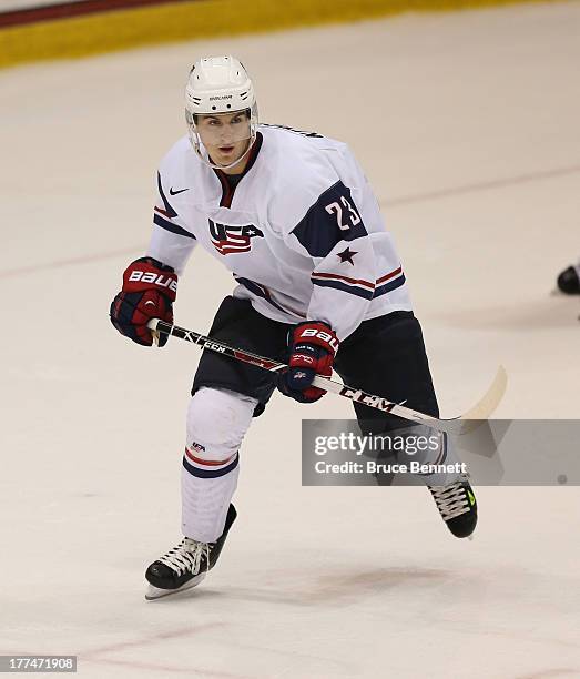 Nic Kerdiles of Team USA skates against Team Sweden during the 2013 USA Hockey Junior Evaluation Camp at the Lake Placid Olympic Center on August 7,...