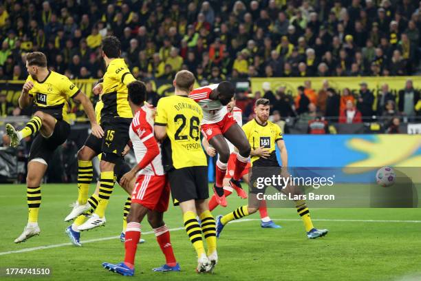 Dayot Upamecano of Bayern Munich scores the team's first goal during the Bundesliga match between Borussia Dortmund and FC Bayern München at Signal...