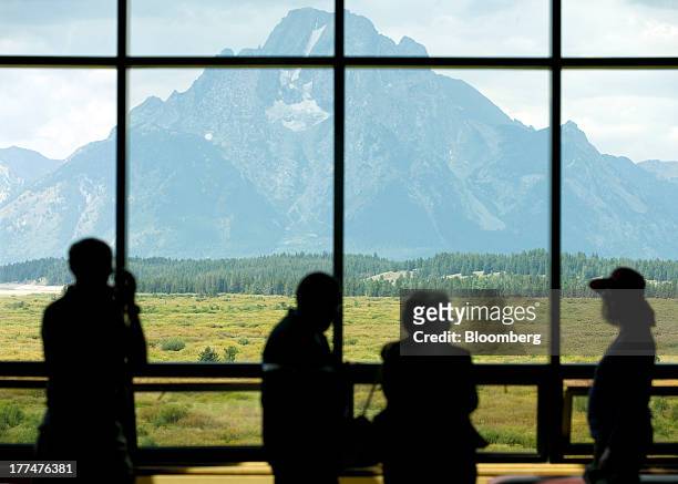Mount Moran in Grand Teton National Park is seen through a window at the Jackson Hole economic symposium, sponsored by the Kansas City Federal...
