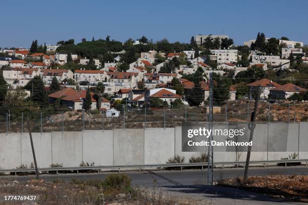 Wall divides the Palestinian West Bank territory and an Israeli settlement on November 04, 2023 from Huwara, West Bank. The war between Israel and...