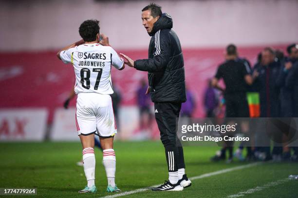 Head Coach Roger Schmidt of SL Benfica and Joao Neves of SL Benfica gesture during the Liga Portugal Bwin match between GD Chaves and SL Benfica on...