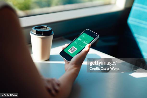 traveling by train with digital train ticket on smartphone - train ticket stock pictures, royalty-free photos & images