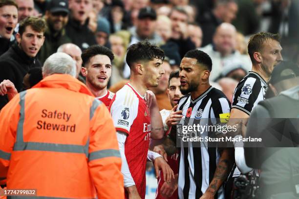 Kai Havertz of Arsenal clashes with Jamaal Lascelles of Newcastle United during the Premier League match between Newcastle United and Arsenal FC at...