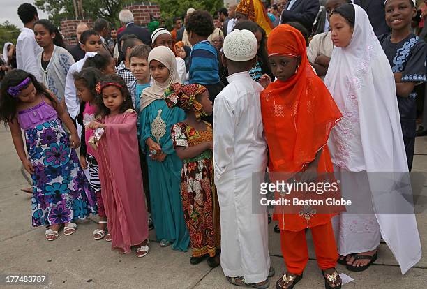 Children from the mosque wait to welcome the mayor. Members of the Islamic Society of Boston Cultural Center and Mayor Thomas M. Menino will joined...