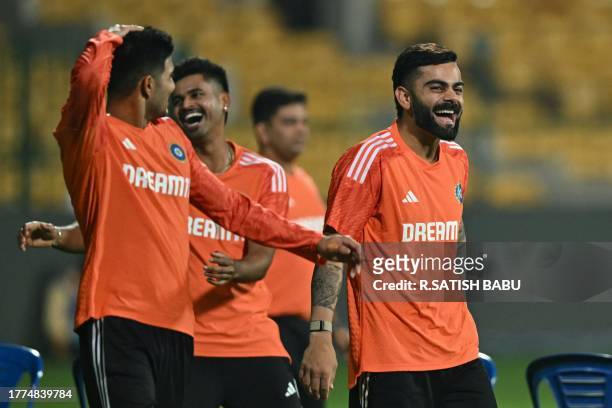 India's Virat Kohli , Shreyas Iyer and Shubman Gill laugh during a practice session ahead of their 2023 ICC Men's Cricket World Cup one-day...