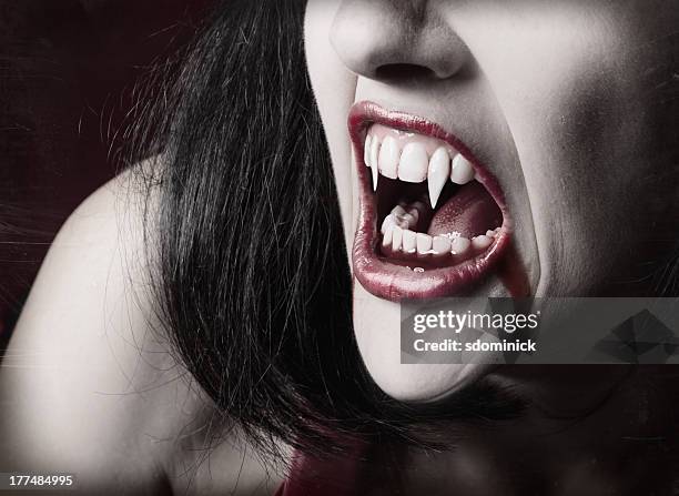 vampire teeth - hoektand stockfoto's en -beelden