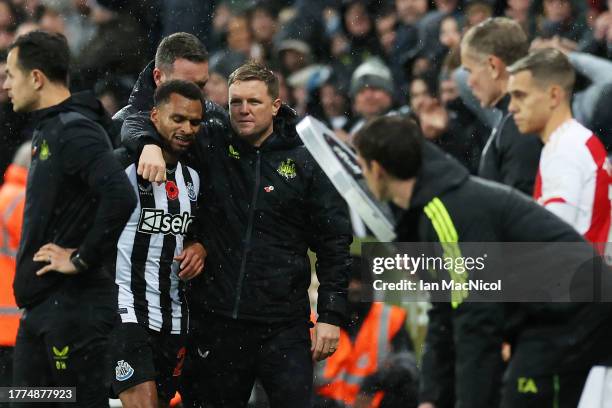 Jacob Murphy of Newcastle United interacts with Eddie Howe, Manager of Newcastle United, after being substituted off during the Premier League match...