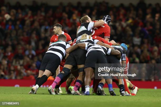 Alun Wyn Jones Captain of the Barbarians grapples with Adam Beard of Wales whilst rucking during the International match between Wales and Barbarians...