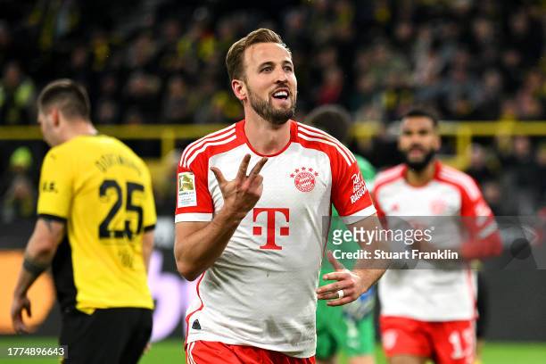 Harry Kane of Bayern Munich celebrates after scoring the team's fourth goal during the Bundesliga match between Borussia Dortmund and FC Bayern...