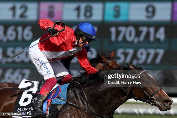 Jockey Lanfranco Dettori reacts to victory atop Inspiral of Great Britain during the Maker's Mark Breeders' Cup Filly and Mare Turf at Santa Anita...