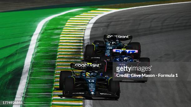 Fernando Alonso of Spain driving the Aston Martin AMR23 Mercedes leads Pierre Gasly of France driving the Alpine F1 A523 Renault and Lance Stroll of...