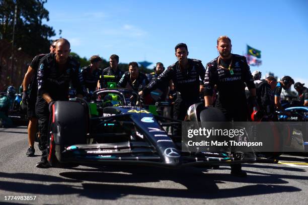 Lewis Hamilton of Great Britain driving the Mercedes AMG Petronas F1 Team W14 is pushed to the grid prior to the Sprint ahead of the F1 Grand Prix of...