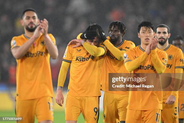 Fabio Silva of Wolverhampton Wanderers is consoled by teammate Boubacar Traore following the team's defeat during the Premier League match between...