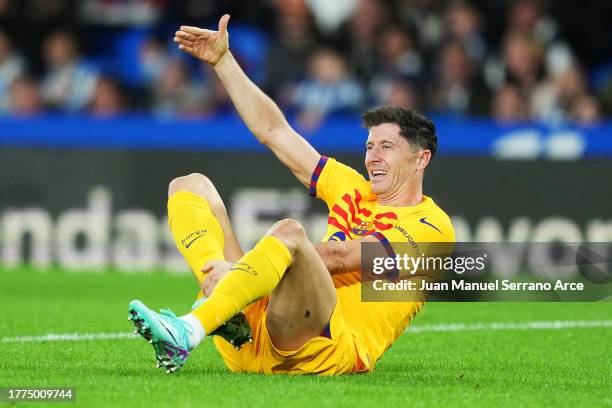 Robert Lewandowski of FC Barcelona goes down with an injury during the LaLiga EA Sports match between Real Sociedad and FC Barcelona at Reale Arena...