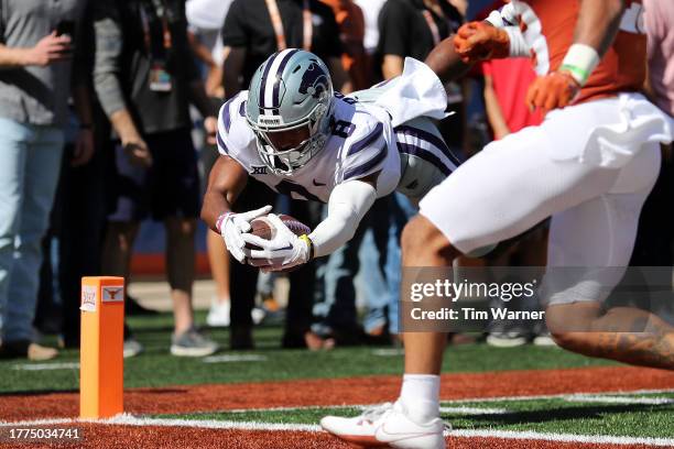 Phillip Brooks of the Kansas State Wildcats dives into the end zone for a touchdown in the third quarter against the Texas Longhorns at Darrell K...