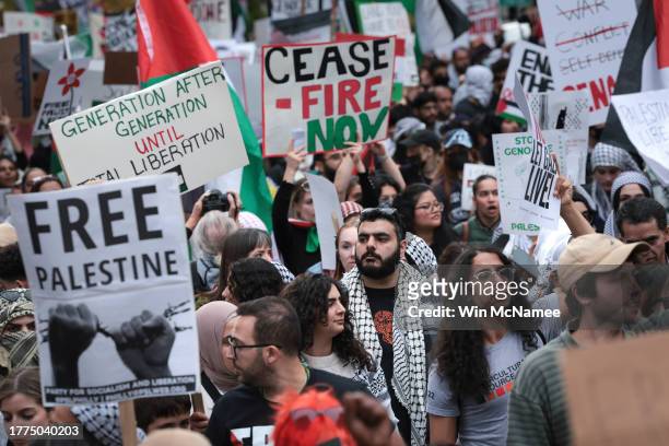 Protesters march from Freedom Plaza during the National March on Washington for Palestine while calling for a ceasefire between Israel and Hamas on...