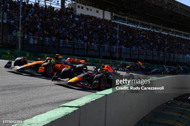 Max Verstappen of the Netherlands driving the Oracle Red Bull Racing RB19 leads Lando Norris of Great Britain driving the McLaren MCL60 Mercedes on...