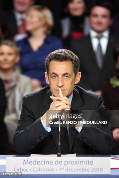 French president Nicolas Sarkozy holds a roundtable at the liberal and ambulatory Health centre in Orbec, northwestern France, on December 1, 2010....