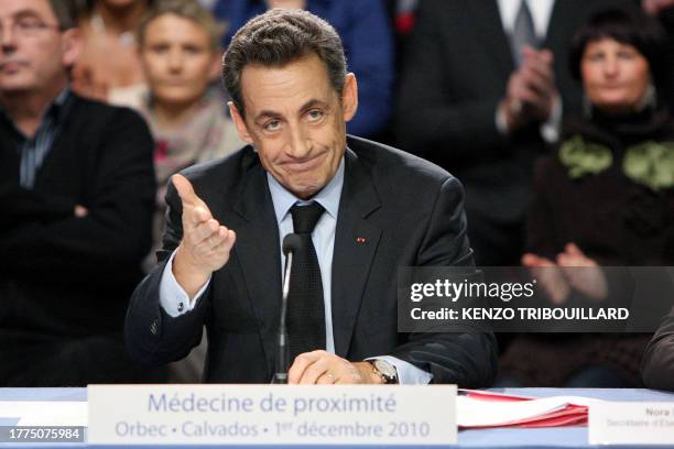 French president Nicolas Sarkozy gestures as he holds a roundtable at the liberal and ambulatory Health centre in Orbec, northwestern France, on...