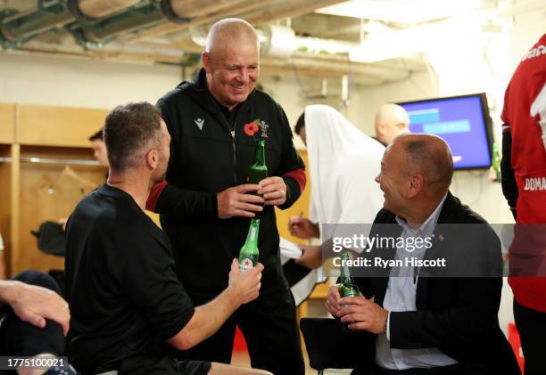 Warren Gatland , Head Coach of Wales, laughs with Eddie Jones, Coach of Barbarians, and Mark Jones, Coach of Barbarians, in the Barbarians changing...