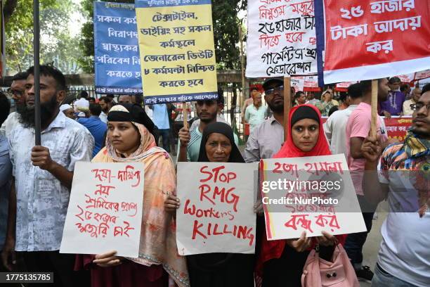 Garment workers' union members take part in a protest to demand an increase in the minimum wage in front of the Press Club in Dhaka, Bangladesh, on...