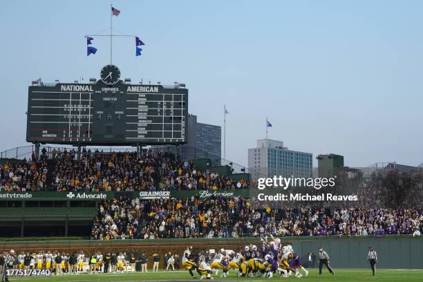 Drew Stevens of the Iowa Hawkeyes kicks a game-winning field goal against the Northwestern Wildcats during the second half at Wrigley Field on...