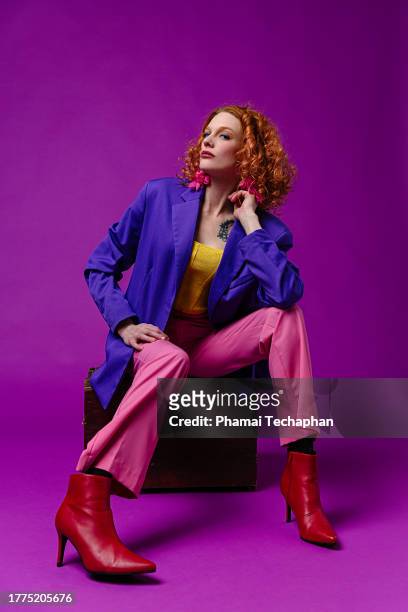stylish woman wearing colorful clothes - purple jacket stock pictures, royalty-free photos & images