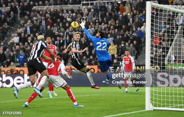 Newcastle player Joelinton challenges Arsenal defender Gabriel in the build up to the Newcastle winning goal as goalscorer Anthony Gordon looks on...