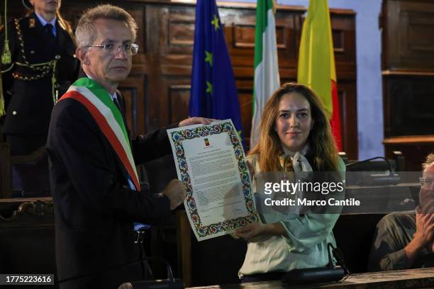 The mayor of Naples Gaetano Manfredi gives Stella Moris the parchment for the awarding of the honorary citizenship of Naples to Julian Assange.