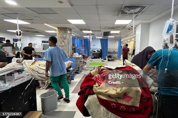 Patients and medics are pictured at Al-Shifa hospital in Gaza City on November 10 amid ongoing battles between Israel and the Palestinian Hamas...