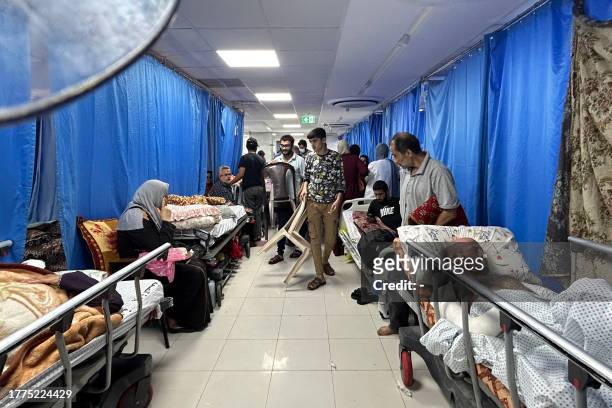 Patients and internally displaced people are pictured at Al-Shifa hospital in Gaza City on November 10 amid ongoing battles between Israel and the...