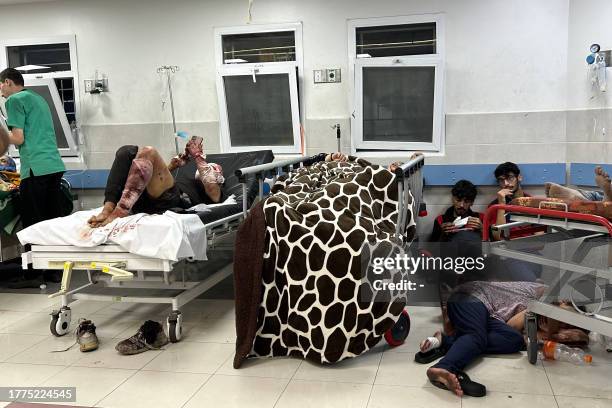 Patients rest at Al-Shifa hospital in Gaza City on November 10 amid ongoing battles between Israel and the Palestinian Hamas movement. Heavy fighting...