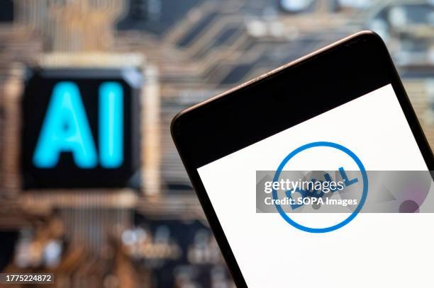 In this photo illustration, the American multinational computer technology company, Dell logo seen displayed on a smartphone with an Artificial...