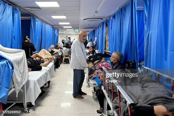 Patients and internally displaced people are pictured at Al-Shifa hospital in Gaza City on November 10 amid ongoing battles between Israel and the...