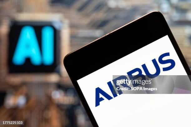 In this photo illustration, the European aerospace multinational and airplane manufacturer Airbus logo seen displayed on a smartphone with an...