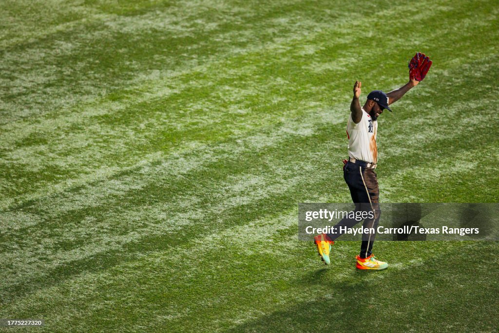 Adolis Garcia of the Texas Rangers smiles during a game against the