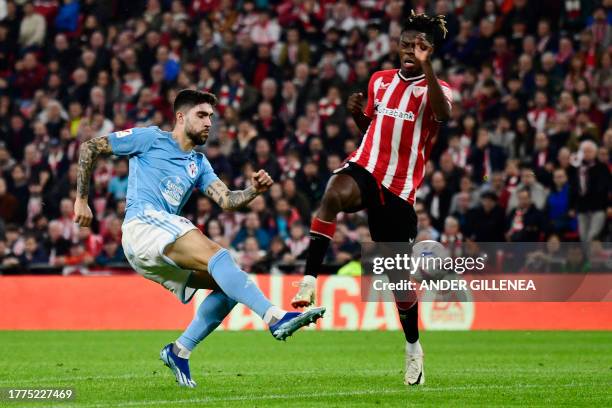 Celta Vigo's Spanish defender Unai Nunez vies with Athletic Bilbao's Spanish forward Nico Williams during the Spanish league football match between...